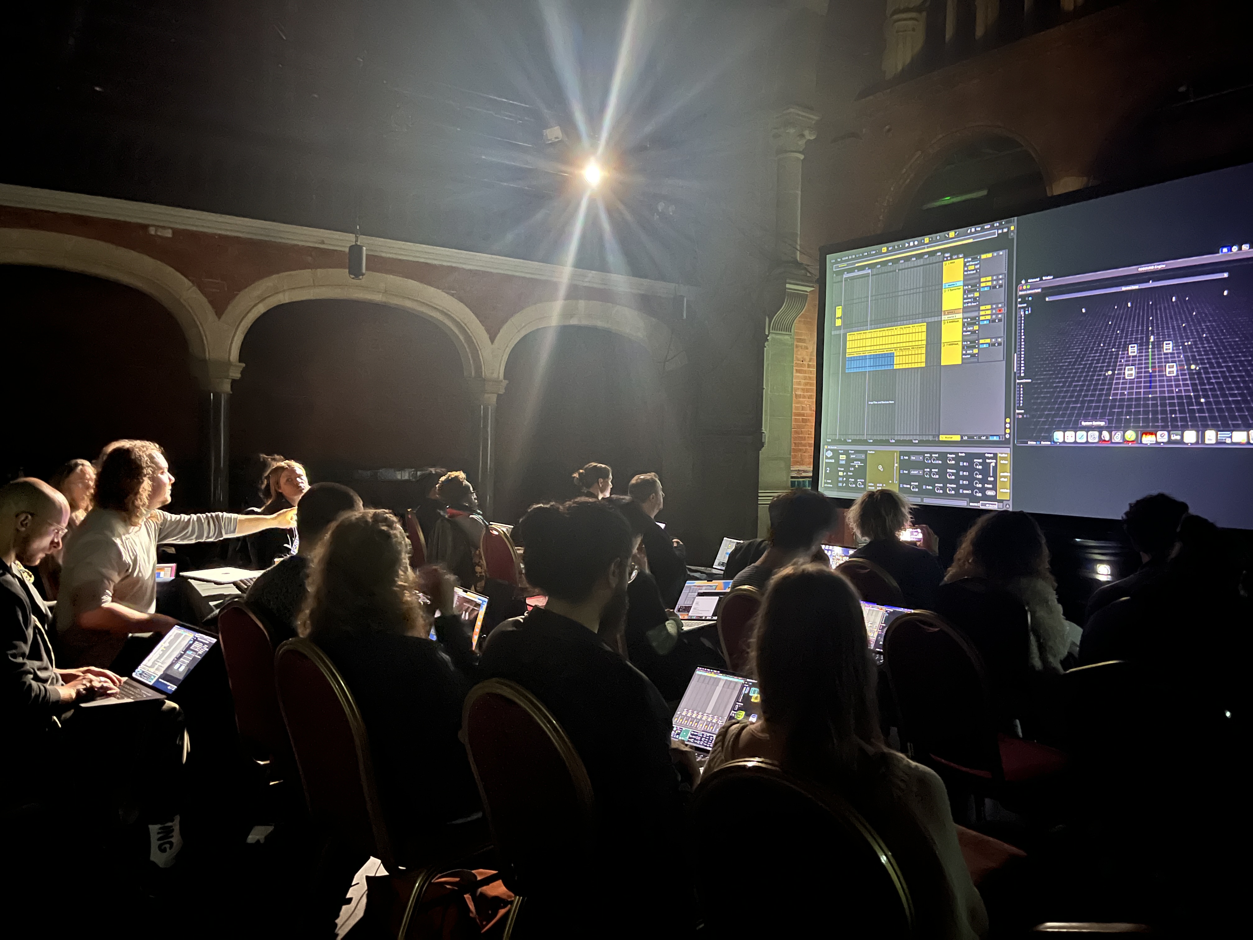 Participants working on laptops at Stone Nest